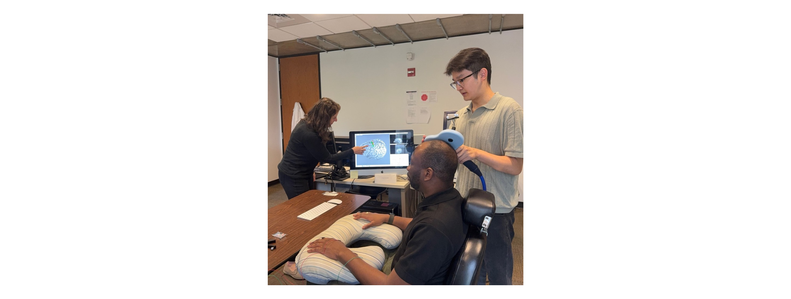 Forrest Lin applying TMS.