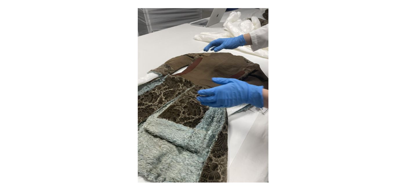 Rodin examining a coat at the Metropolitan Museum of Art