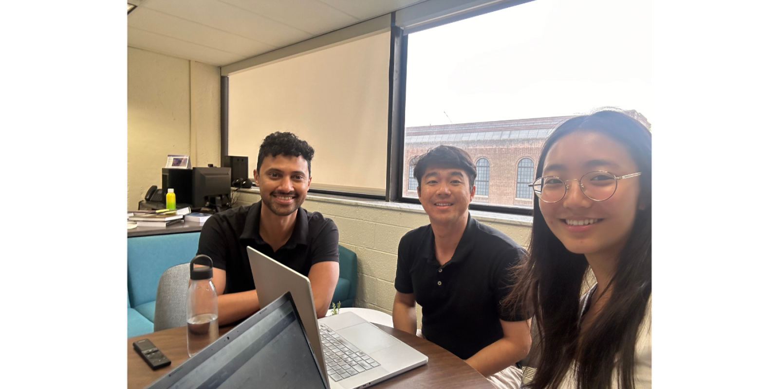 Emma Yao (right) sits with Jason Lee (center) and Mathew Madhavacheril (left).