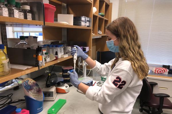 Aria Fasse in the Shaffer Lab using a micropipette