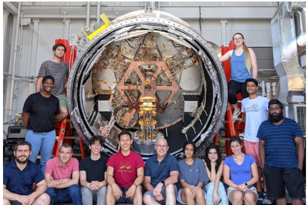 Many students and faculty with a large telescope component