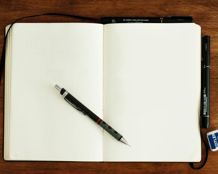 pencil and blank notebook