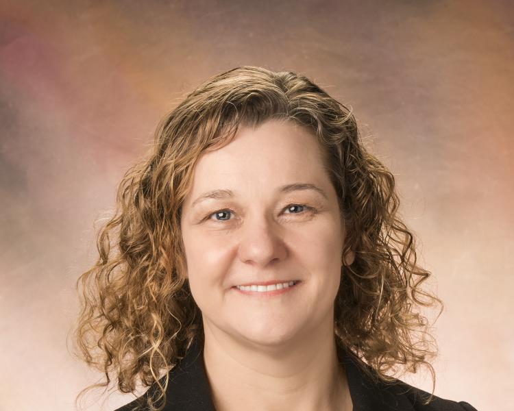 a photograph of a middle aged woman